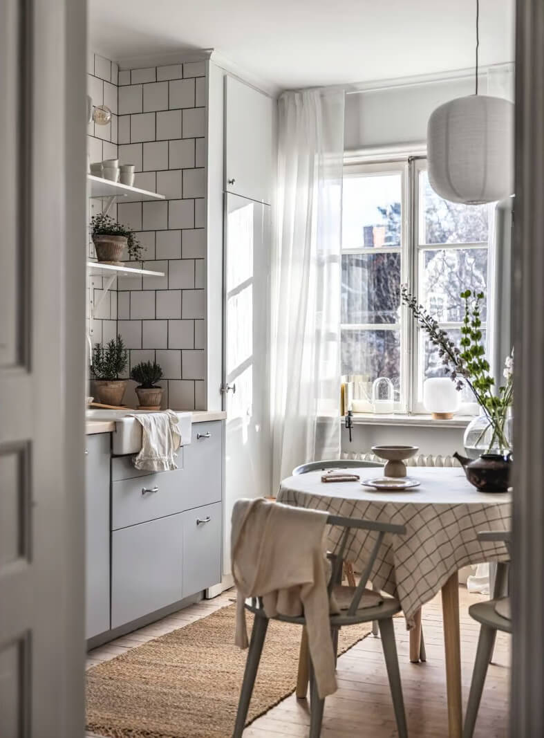 scandi kitchen gray cabinets white tiles round table nordroom