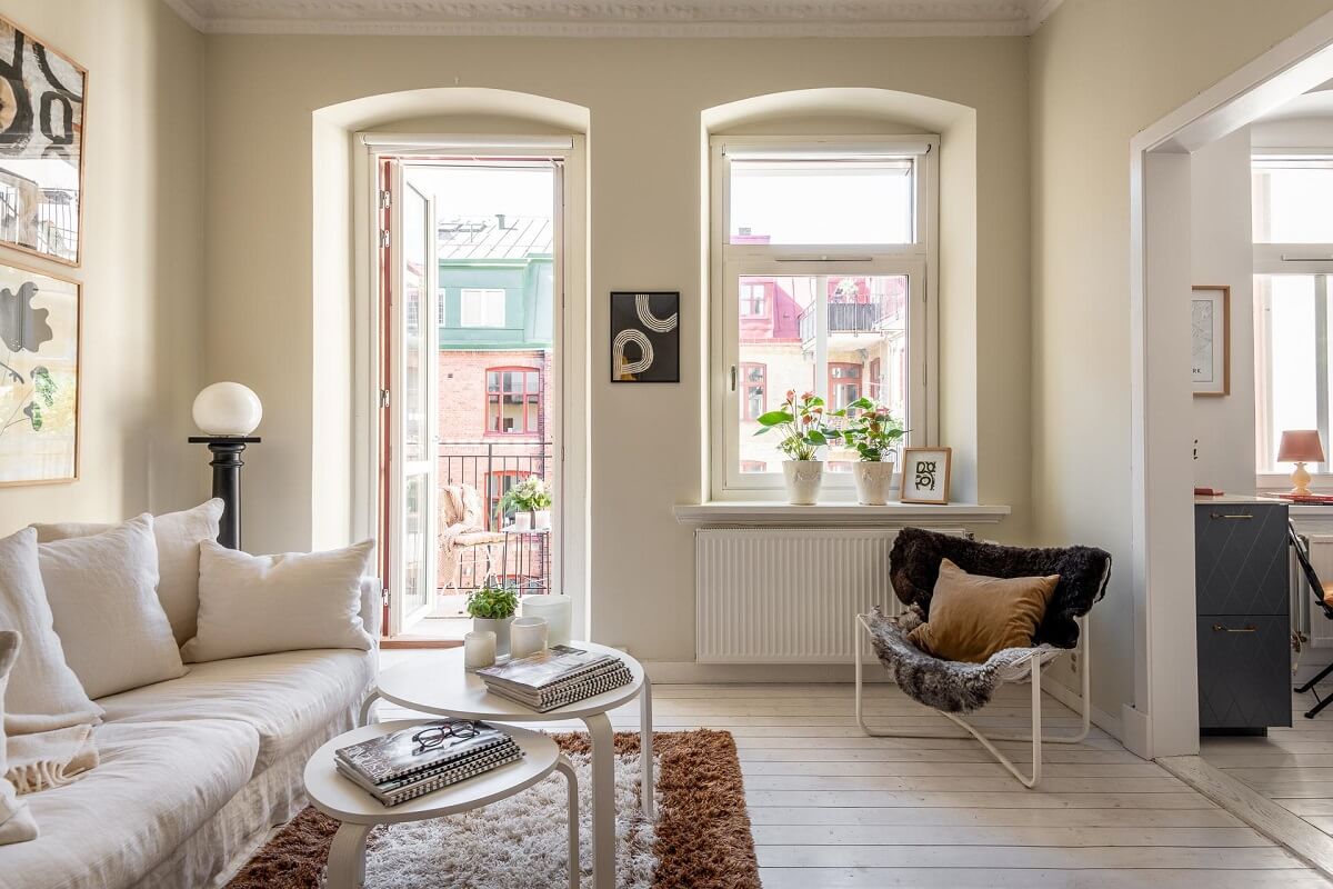 Warm, Neutral Colors in a Lovely Swedish Apartment 5 scandi living room with balcoy