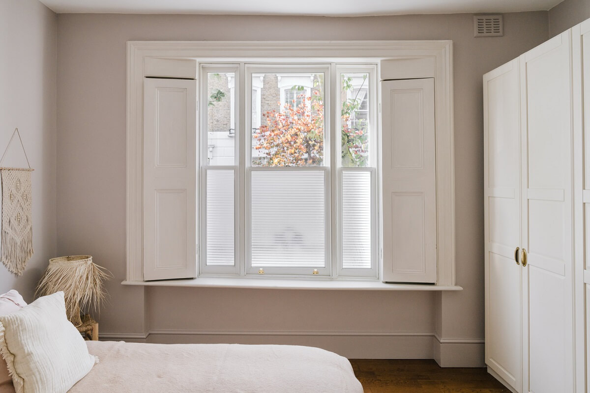 A Charming One-Bedroom Apartment with a Courtyard Terrace 12 serene bedroom with shutters and wardrobes