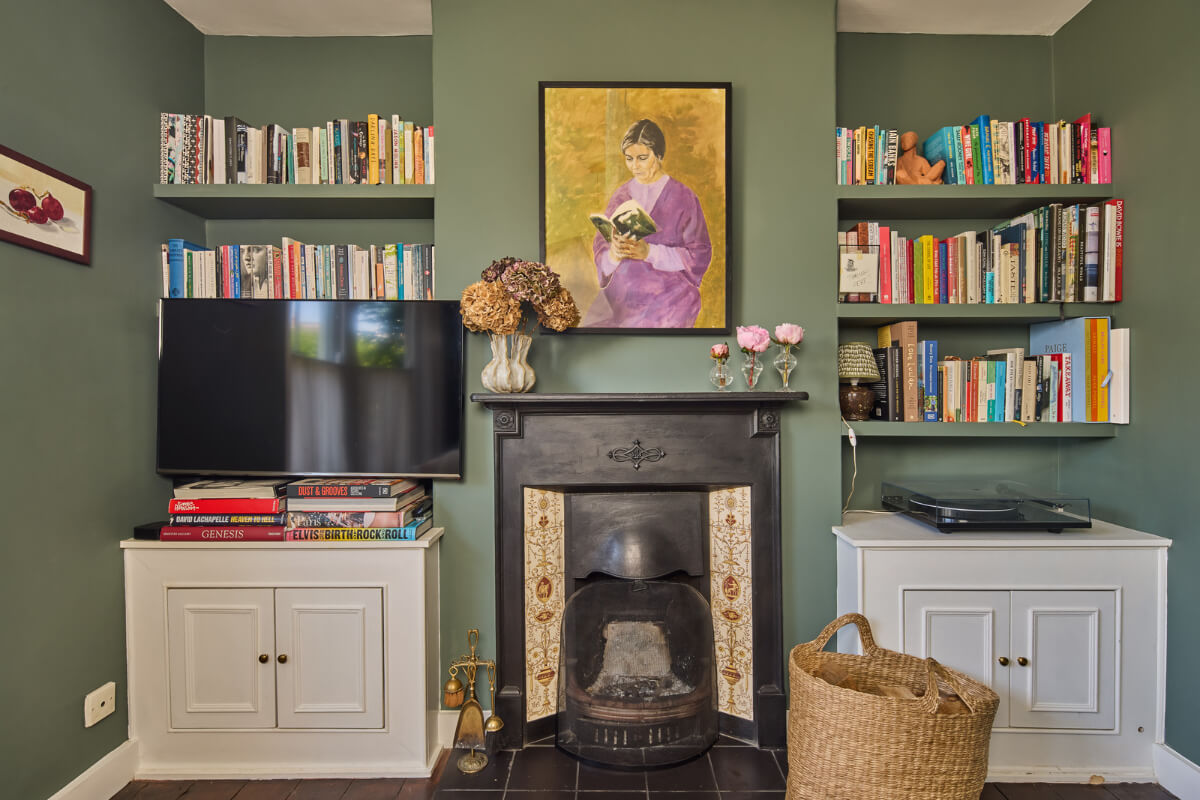 A 19th Century London Cottage with a Stunning Kitchen Extension 2 sitting room original fireplace bookshelves
