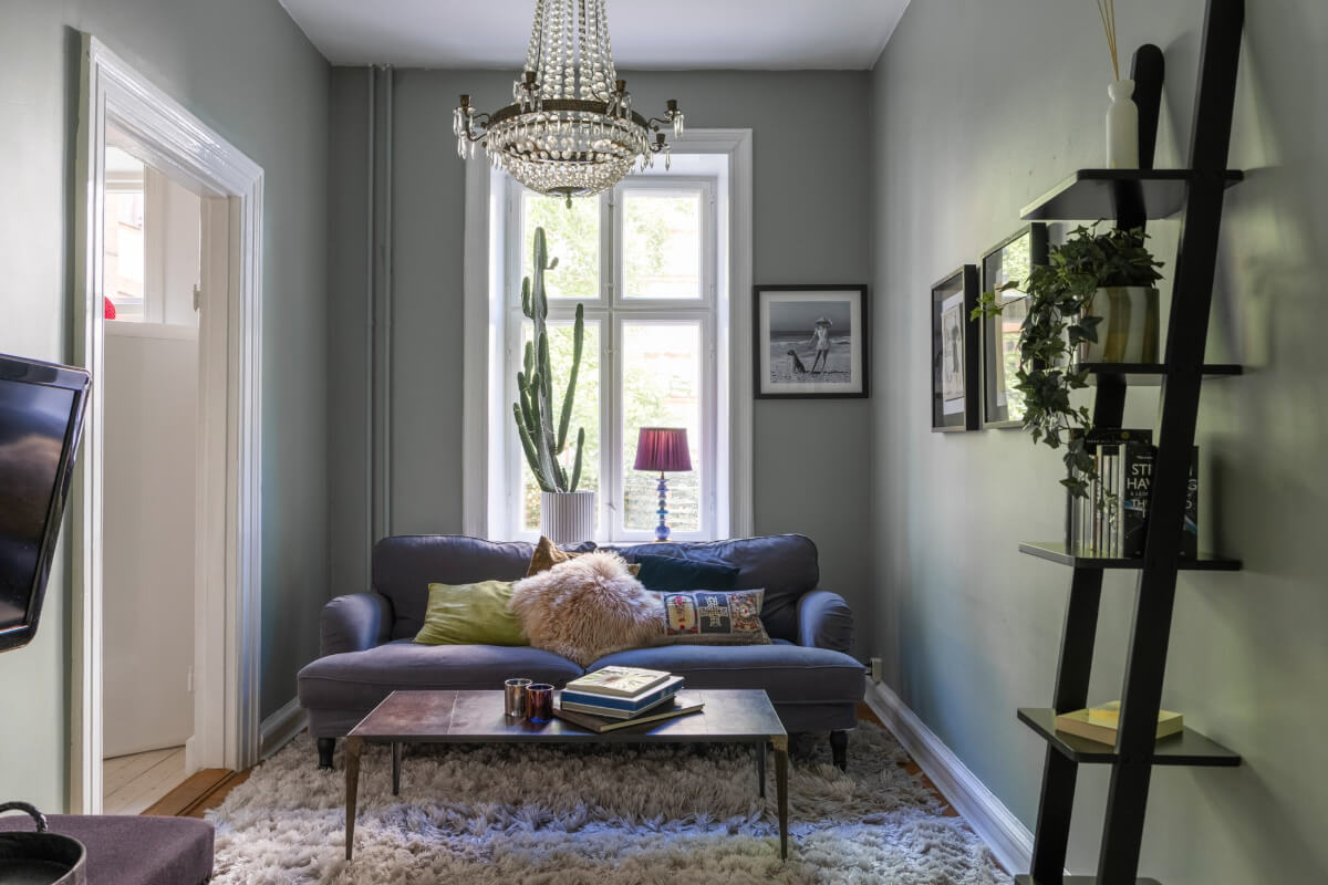 Classic Proportions and a Charming Kitchen in a Malmö Apartment 1 small gray living room blue sofa