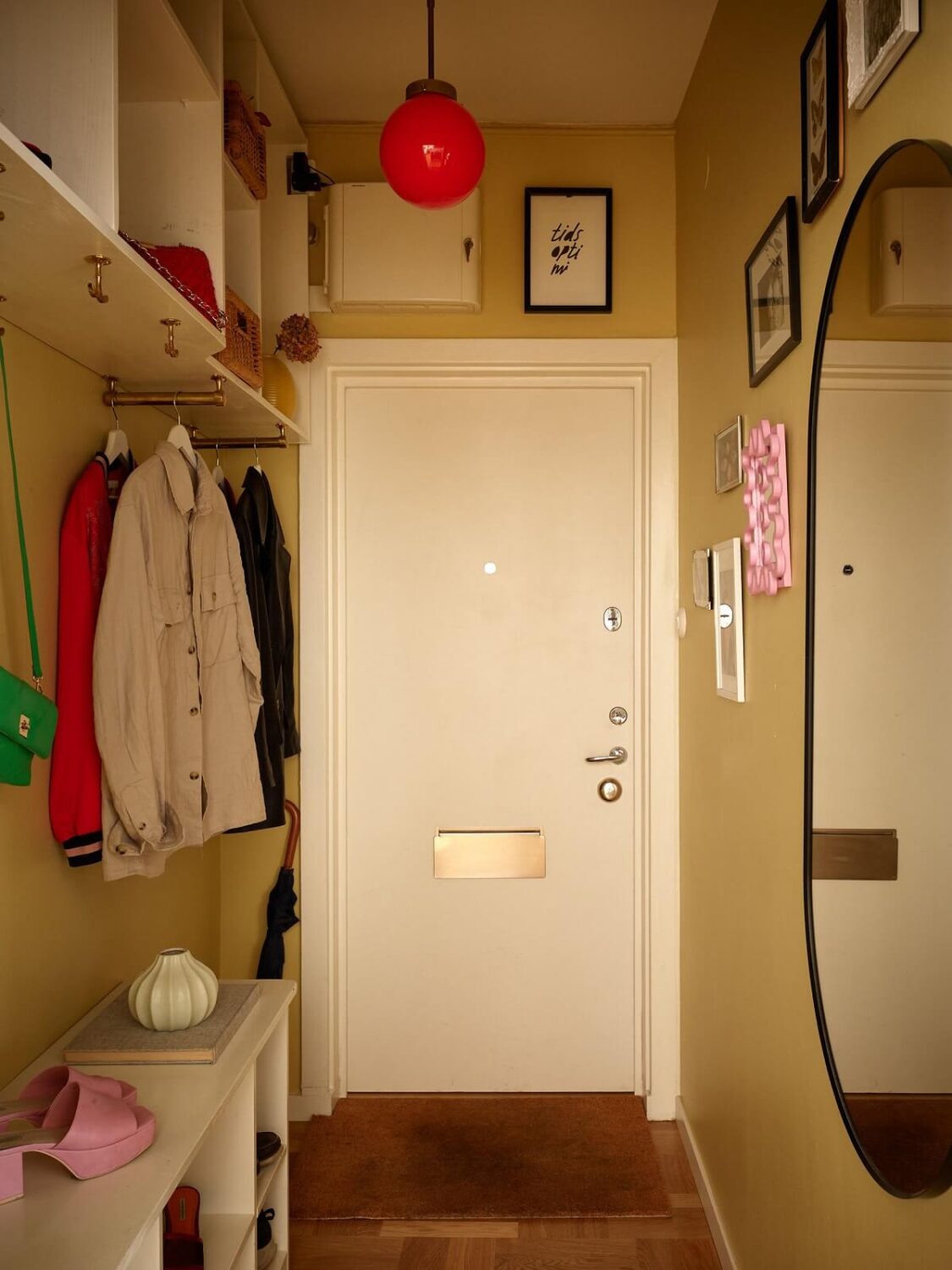 Stylish Small Entryway Ideas with Smart Storage Solutions 15 small-hallway-yellow-walls-mirror-built-in-coat-storage-nordroom