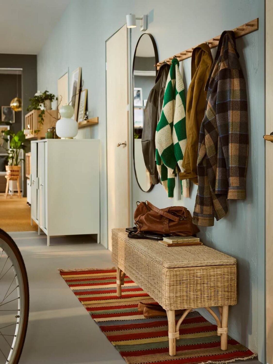 Stylish Small Entryway Ideas with Smart Storage Solutions 16 small ikea hallway with wooden hooks rattan bench and colorful rug nordroom