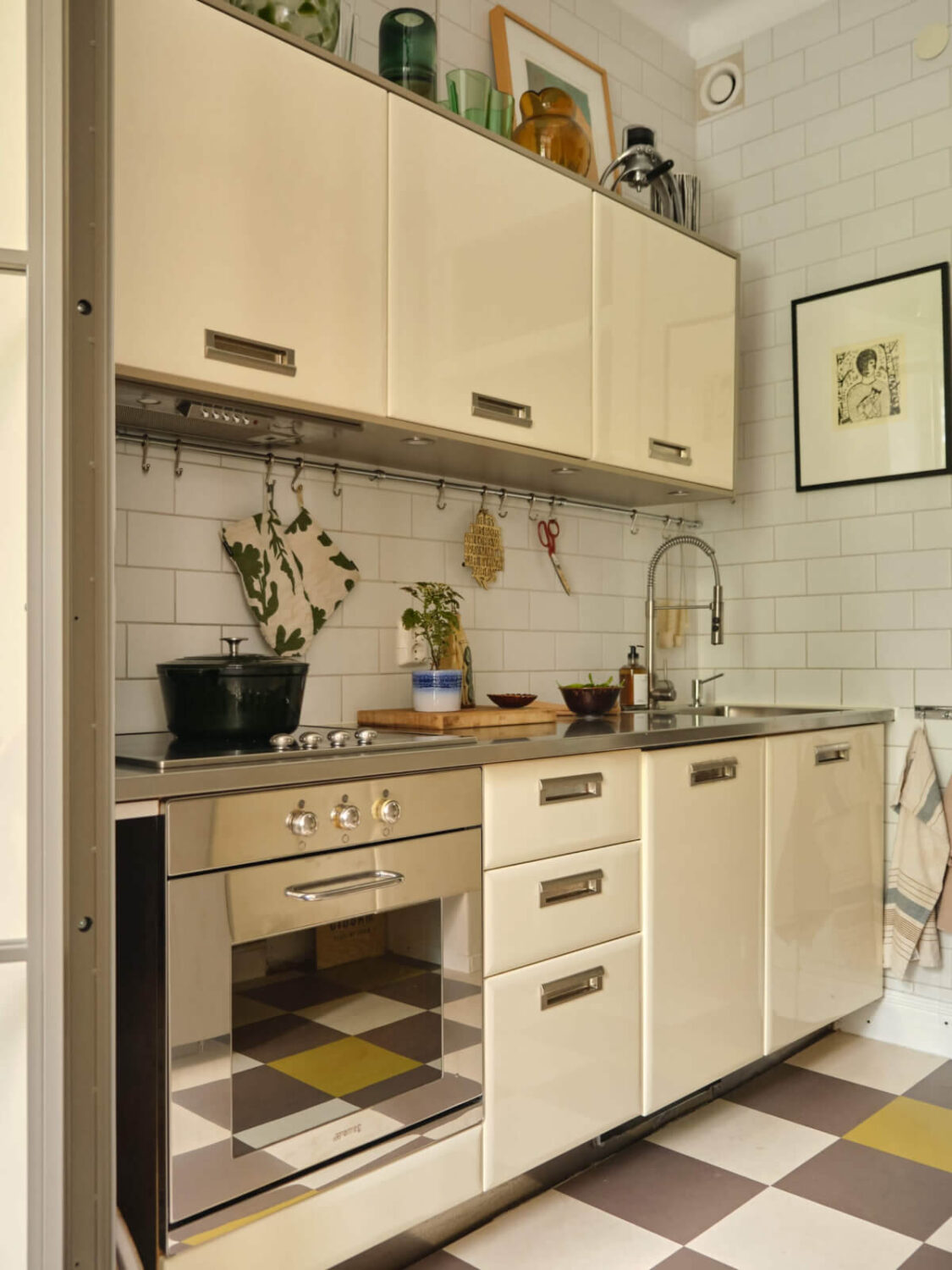 A Beautiful Color Palette and Historic Elements in a Stockholm Apartment 17 small kitchen checkerboard floor