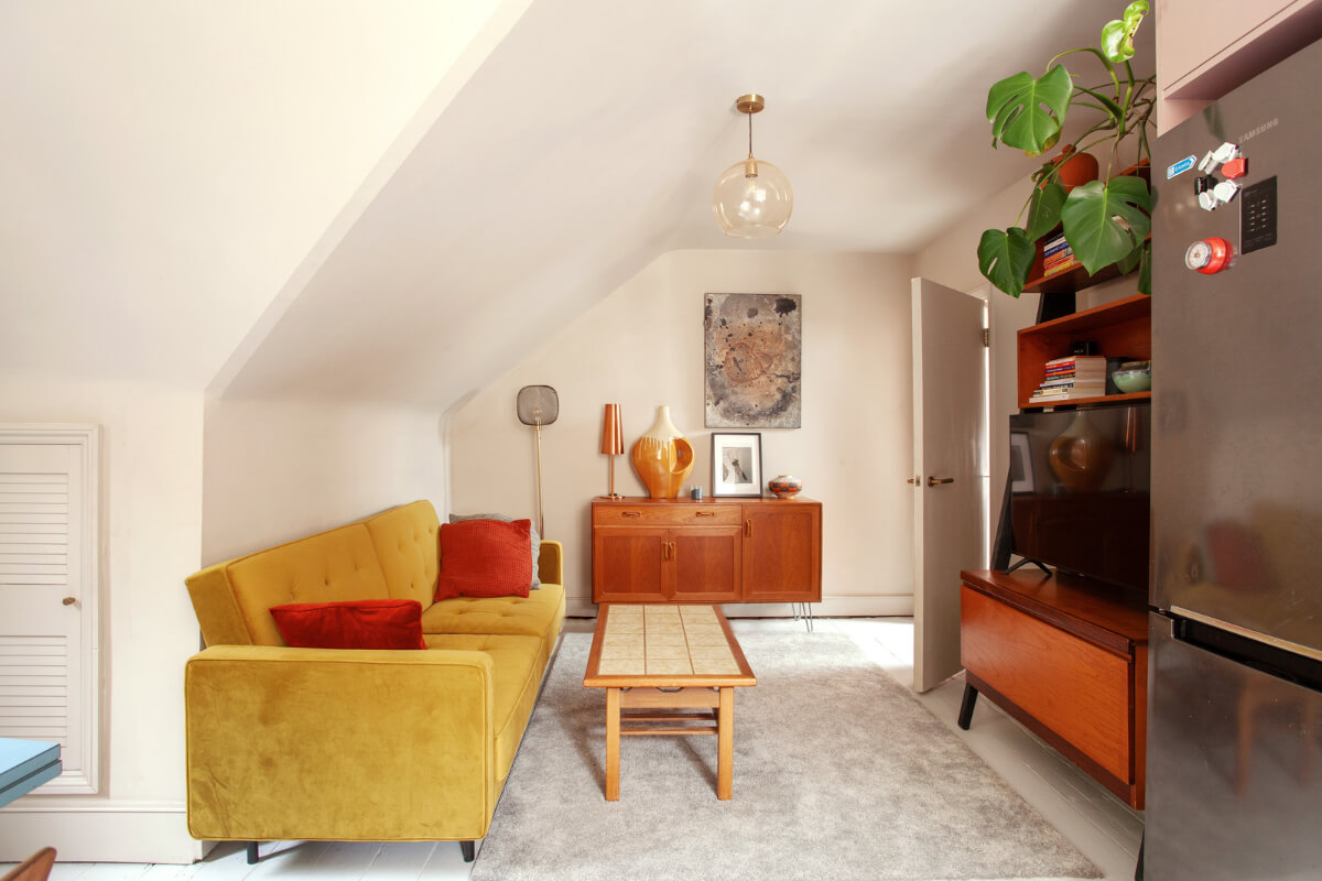 Pastel Tones and Midcentury Design in a Top Floor London Apartment 12 small living room mustard yellow sofa