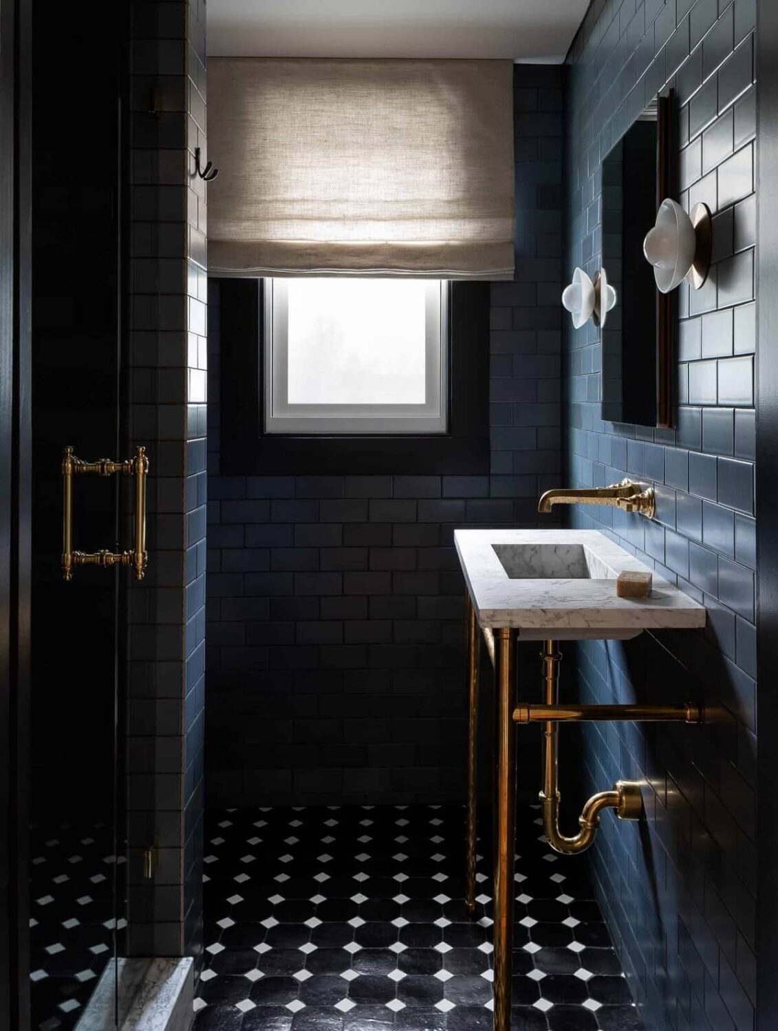 Moody, not Gloomy! Beautiful Dark Small Bathrooms 1 small moody bathroom with dark blue tiles and marble sink nordroom