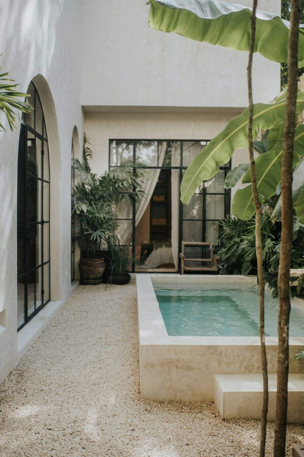Rustic Wooden Elements in a Stylish Tulum Airbnb 29 small-swimming-pool-patio-garden-steel-framed-glass-doors-nordroom
