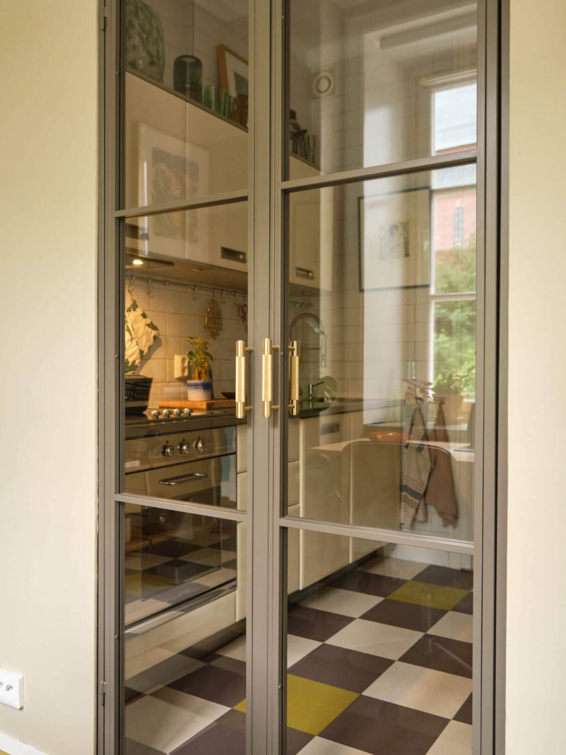 A Beautiful Color Palette and Historic Elements in a Stockholm Apartment 15 steel doors detail