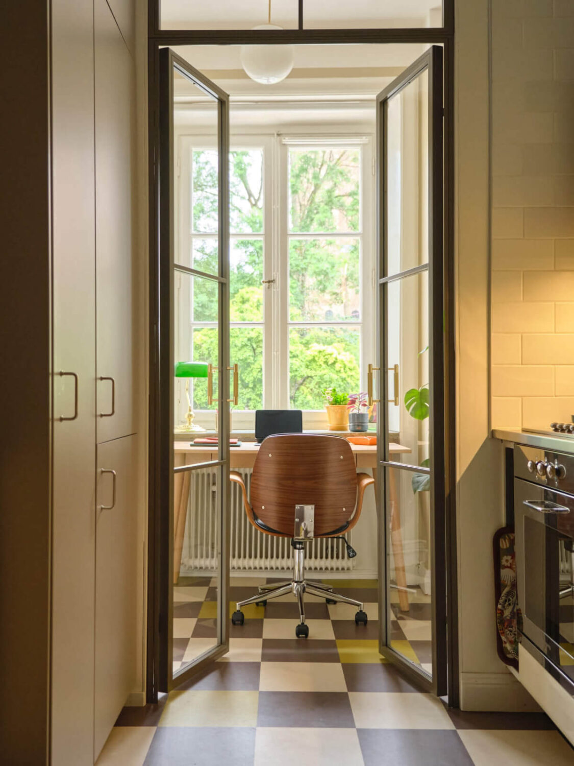 A Beautiful Color Palette and Historic Elements in a Stockholm Apartment 16 steel doors into home office
