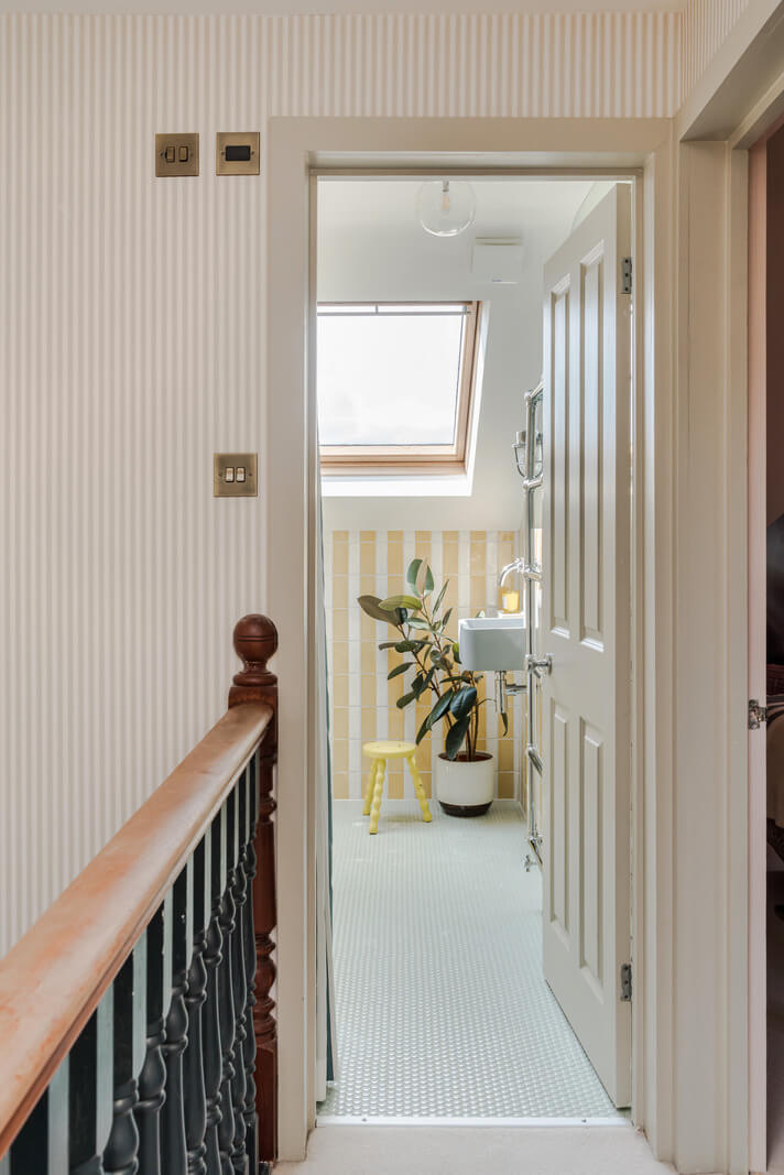 Color, Pattern, and Texture in a Renovated London Townhouse 24 striped hall view into bathroom