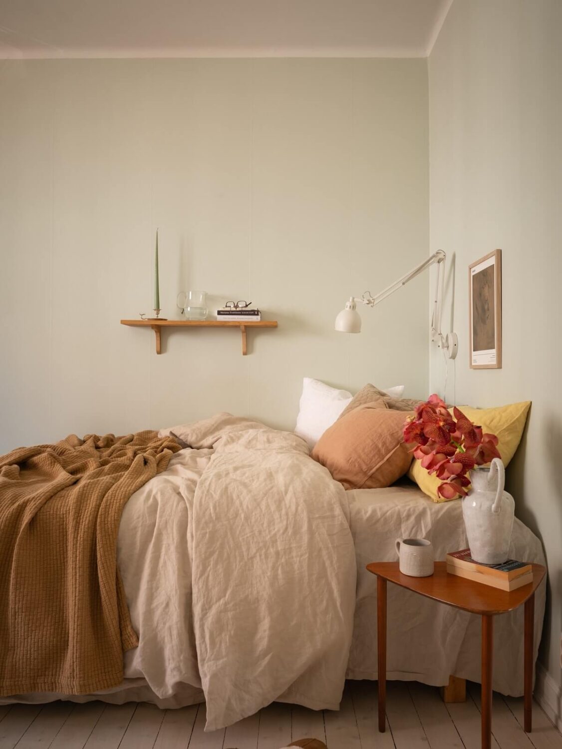 studio apartment bed area with shelf