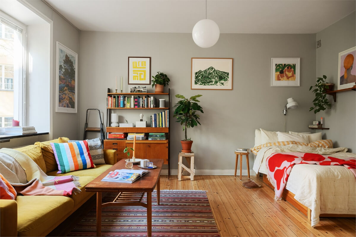 Midcentury Design and Colorful Decor in a Charming Studio Apartment 3 studio apartment gray walls midcentury furniture ochre sofa