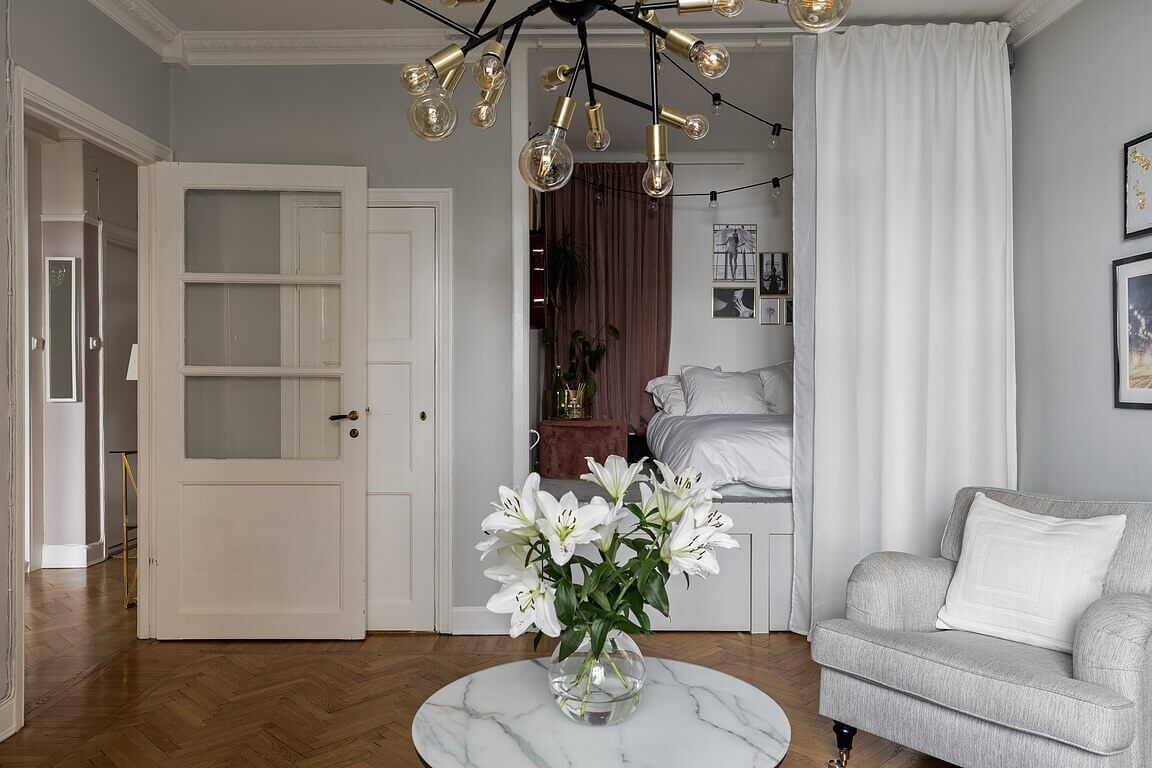 52 Studio Apartments with a Curtain Room Divider 25 studio-apartment-raised-bed-platform-underneath-storage-curtain-room-divider-nordroom