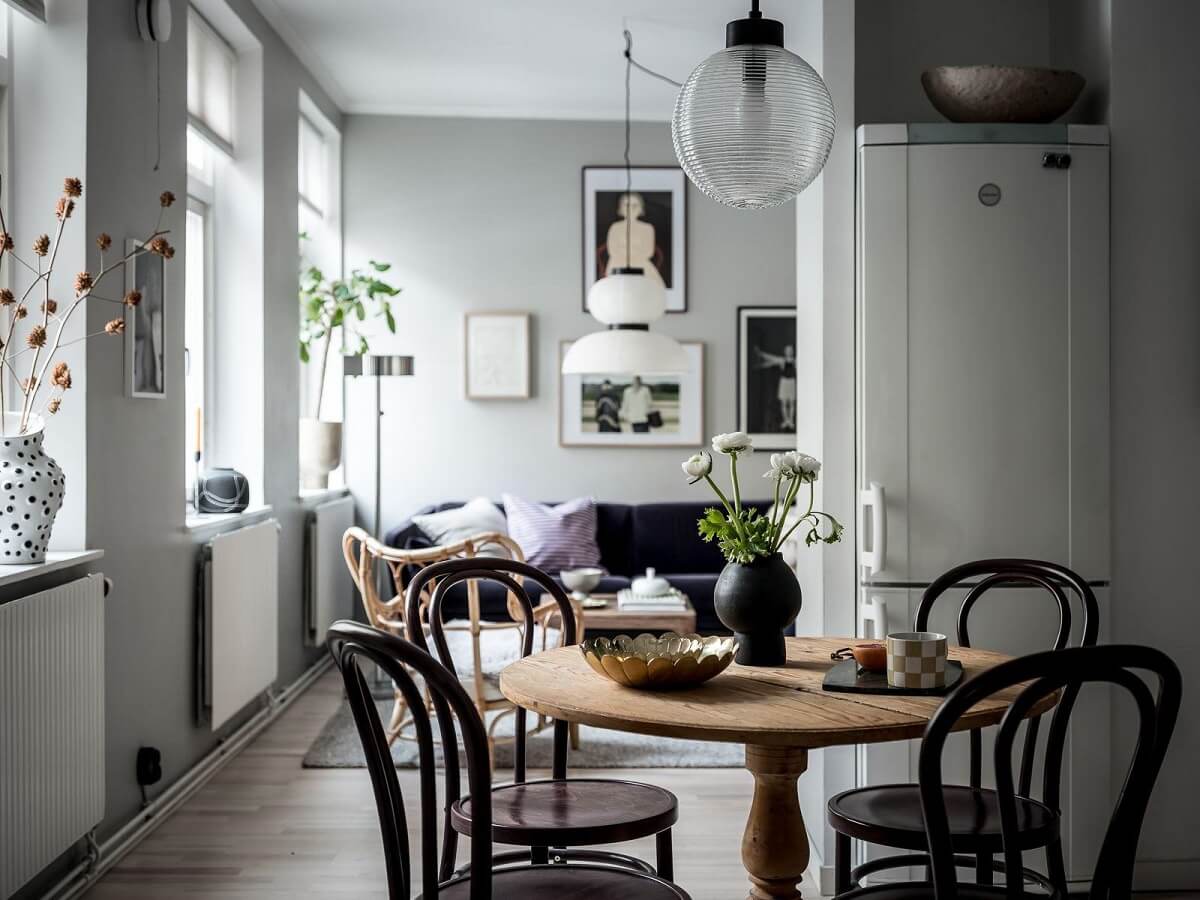 A Cozy Monochrome Gray Studio Apartment 12 studio apartment with round dining table gray wals nordroom