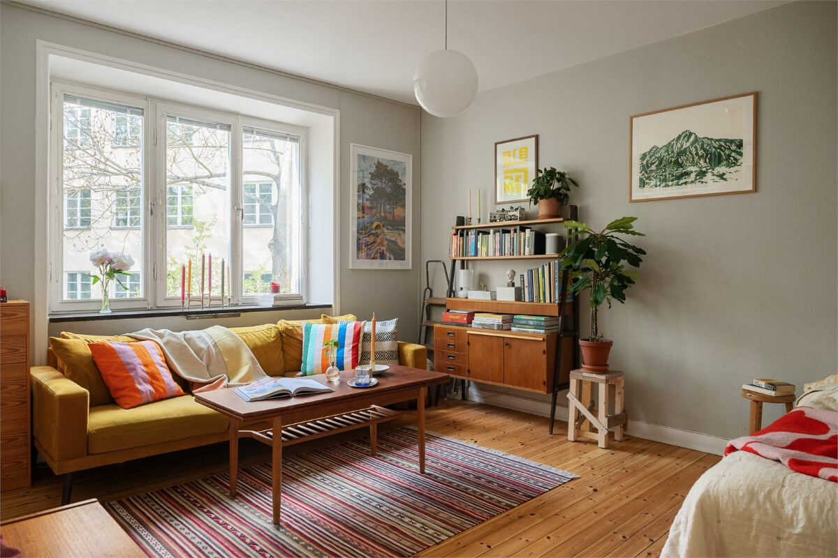 Midcentury Design and Colorful Decor in a Charming Studio Apartment 5 studio wooden floor ochre sofa midcentury furniture nordroom