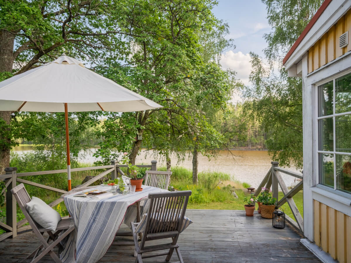 A 1930s Lakeside Country House with a Private Beach 24 terrace lakeside home