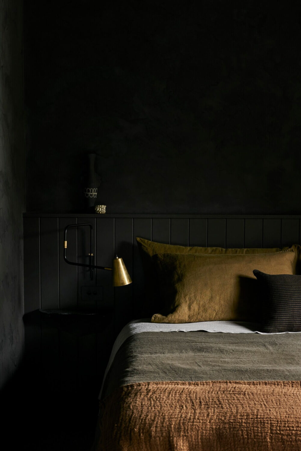 The River Studio: Moody Tones and Luxury in an Australian Airbnb 7 the-river-studio-airbnb-bedroom-earthy-colored-textiles-nordroom
