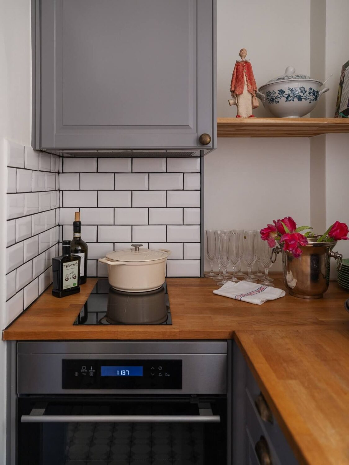 The Pros and Cons of a Wooden Kitchen Countertop 11 tiny gray kitchen with subway tiles and wooden worktop nordroom