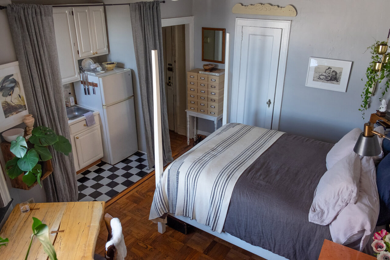 52 Studio Apartments with a Curtain Room Divider 37 tiny-studio-apartment-gray-curtain-room-divider-hides-kitchen-nordroom