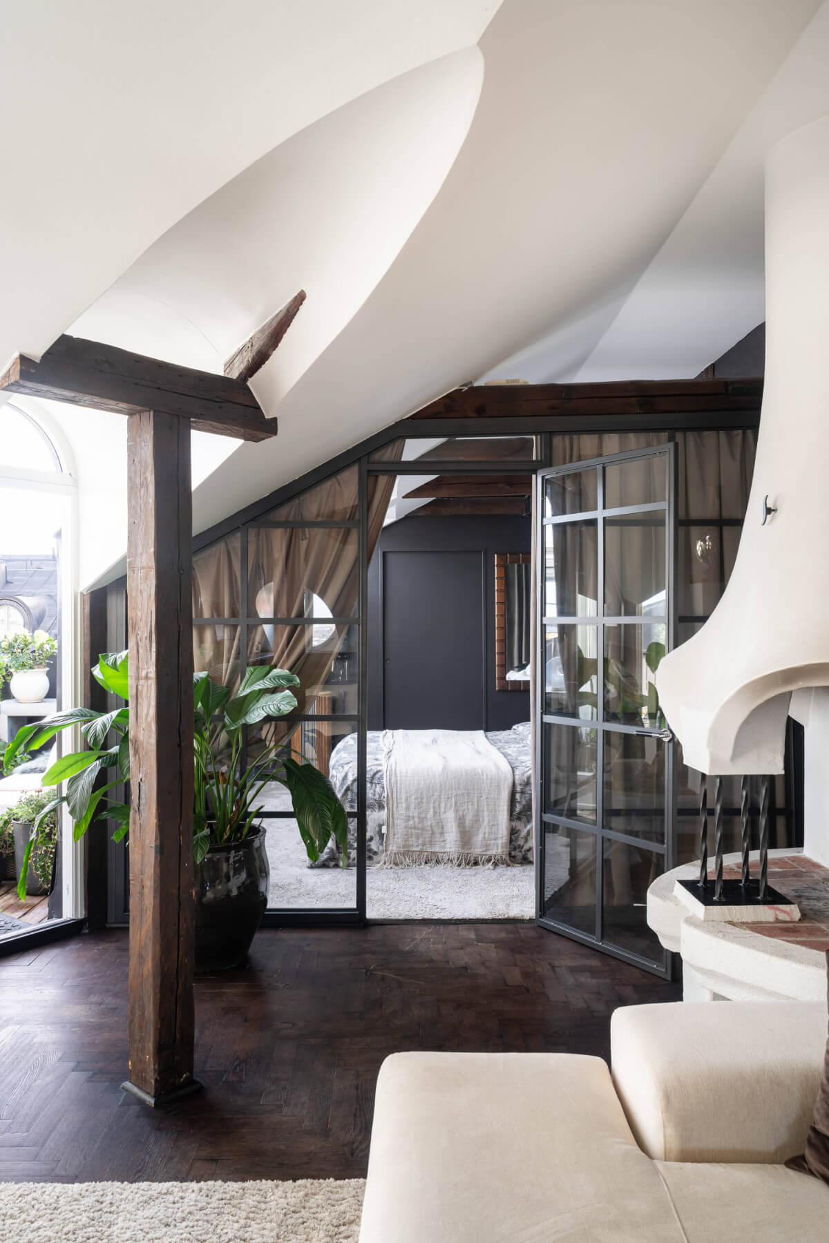 top floor apartment exposed beams industrial glass wall to bedroo nordroom