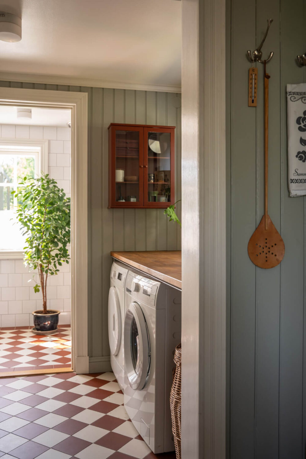 A Charming Historic Country House North of Stockholm 23 utility room checkerboard floor