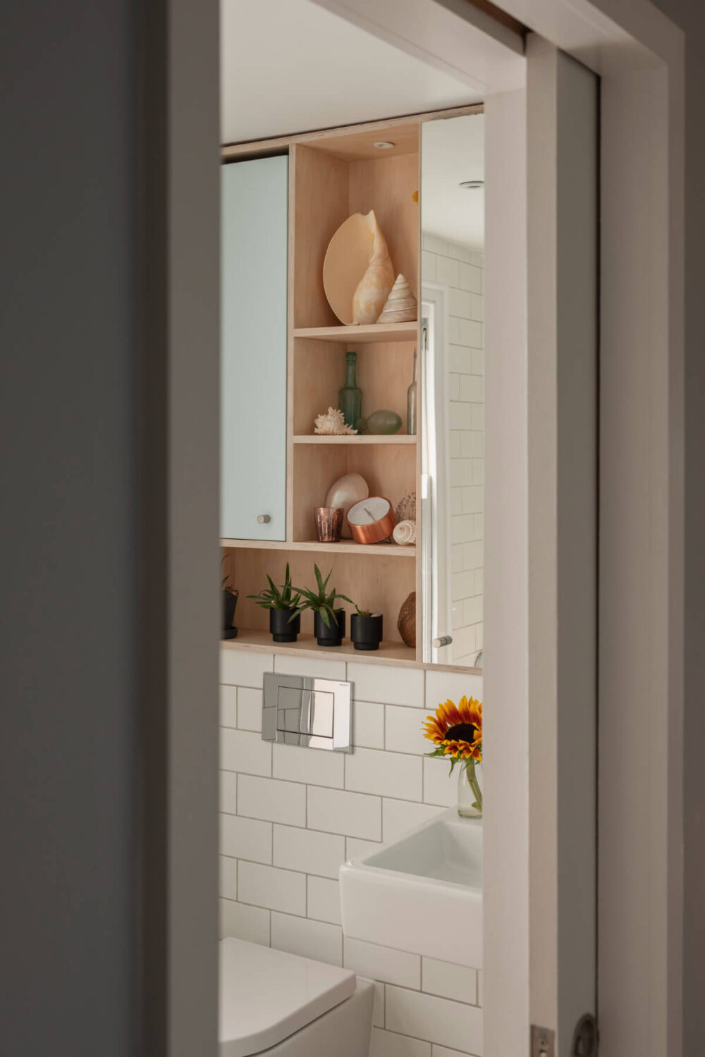 Exposed Brick and Wooden Beams in an Extended London Home 29 view into bathroom