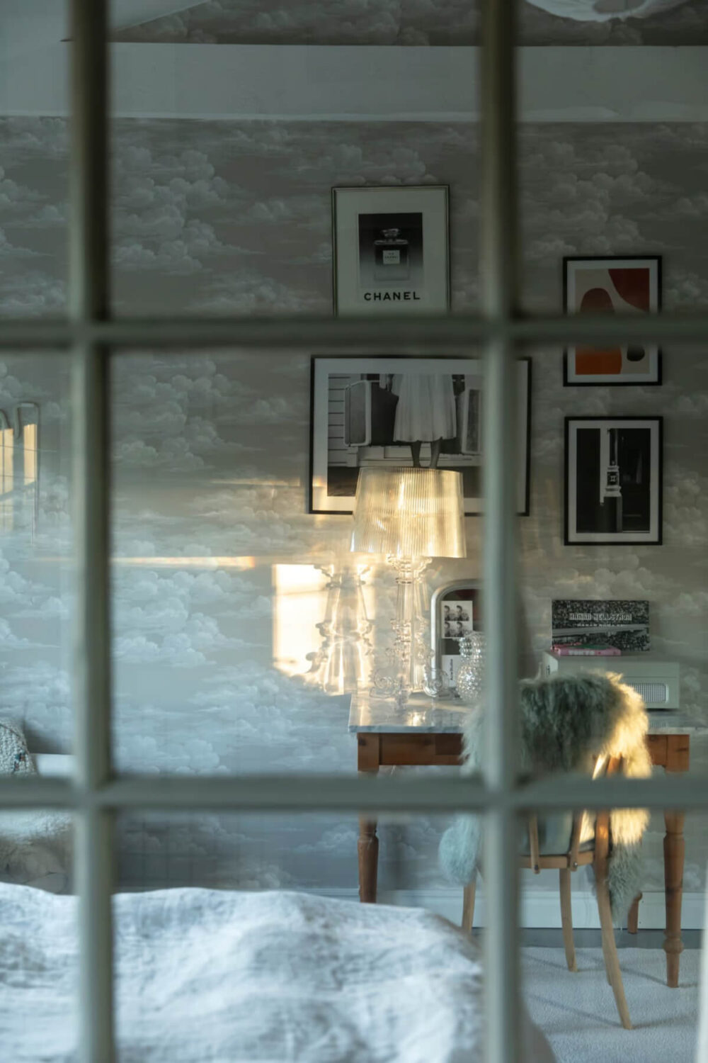 An Open-Plan Gray Home in a Former Textile Factory 12 view into bedroom with marble topped wooden desk