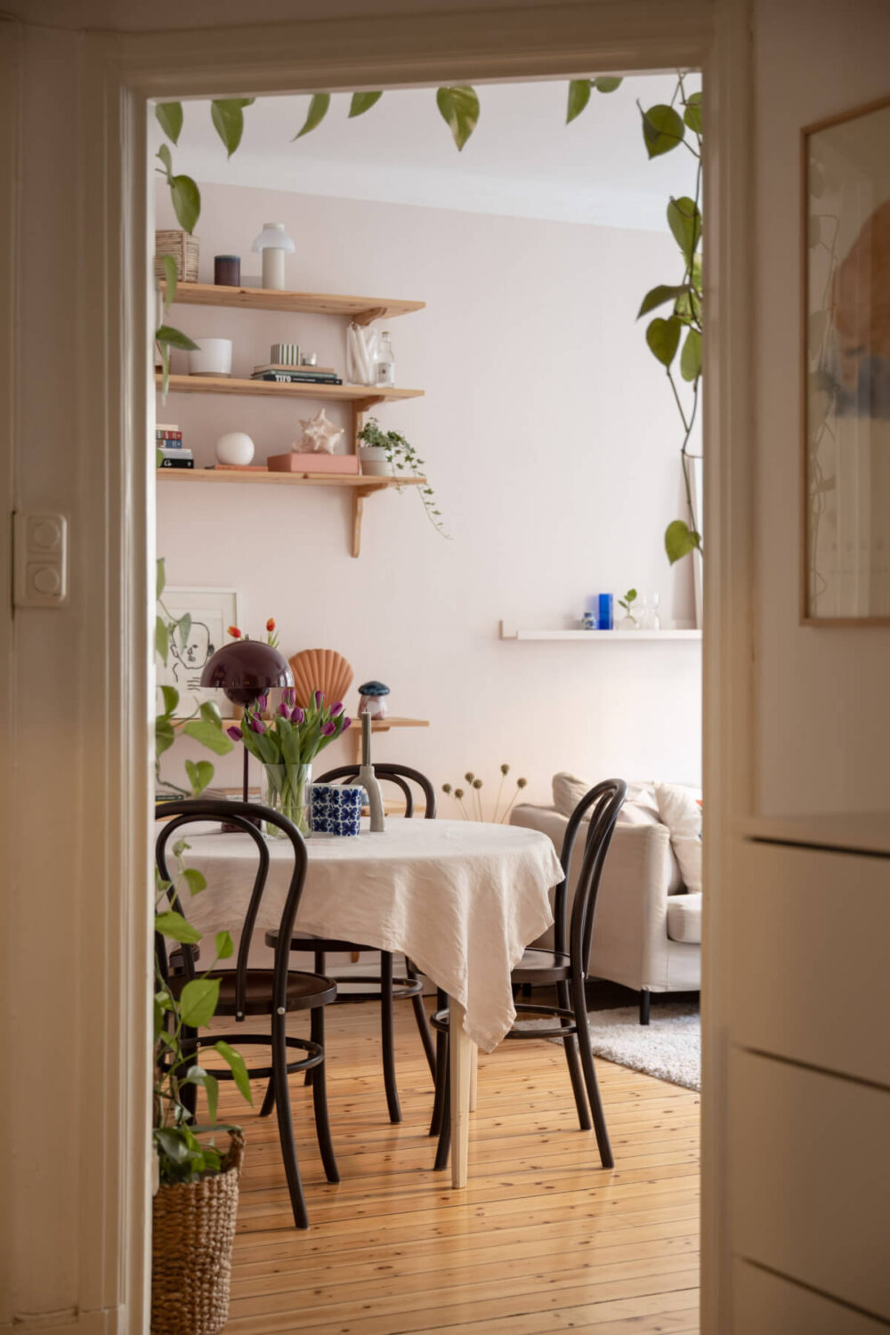 A Small Swedish Apartment with a Light Pink Living Room 10 view into living room