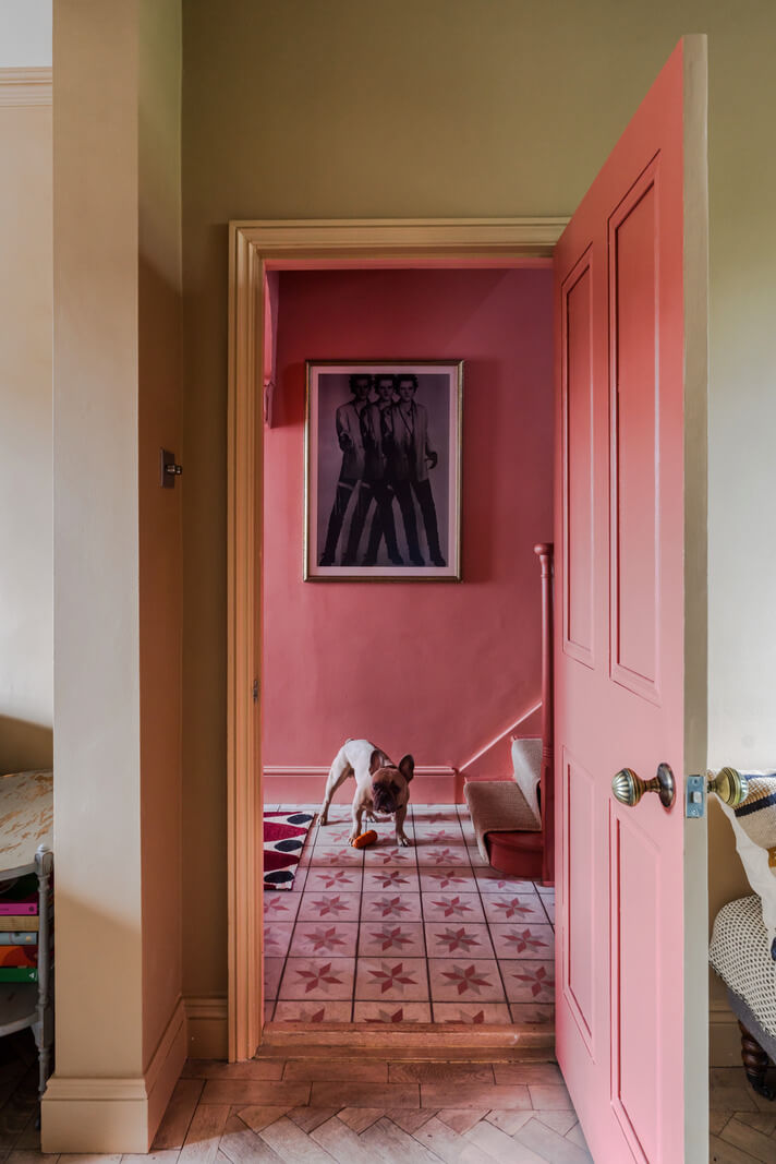 A Victorian Home with a Rich Color Palette and a Beautiful Garden 5 view into pink hall