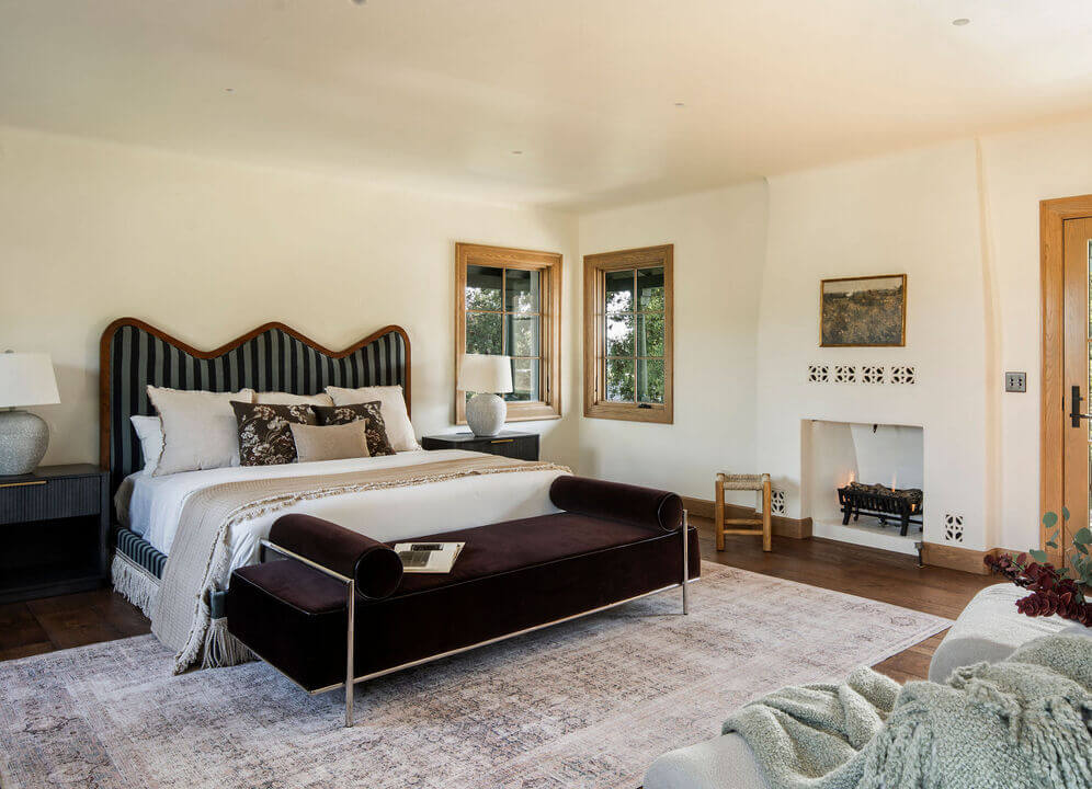 A Reimagined Spanish Colonial Revival Estate in Los Angeles 11 waby headboard fireplace