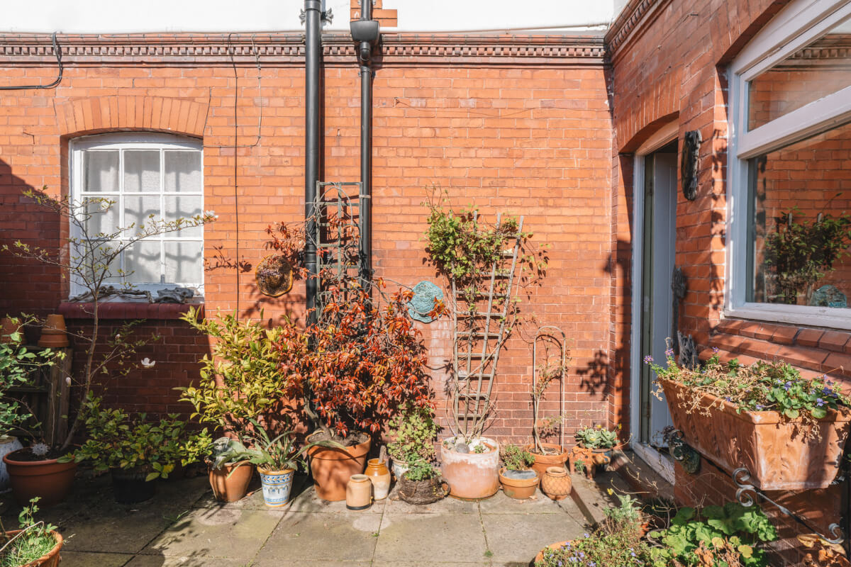 A Sage Green Kitchen in a Charming Arts and Crafts House 17 walled garden