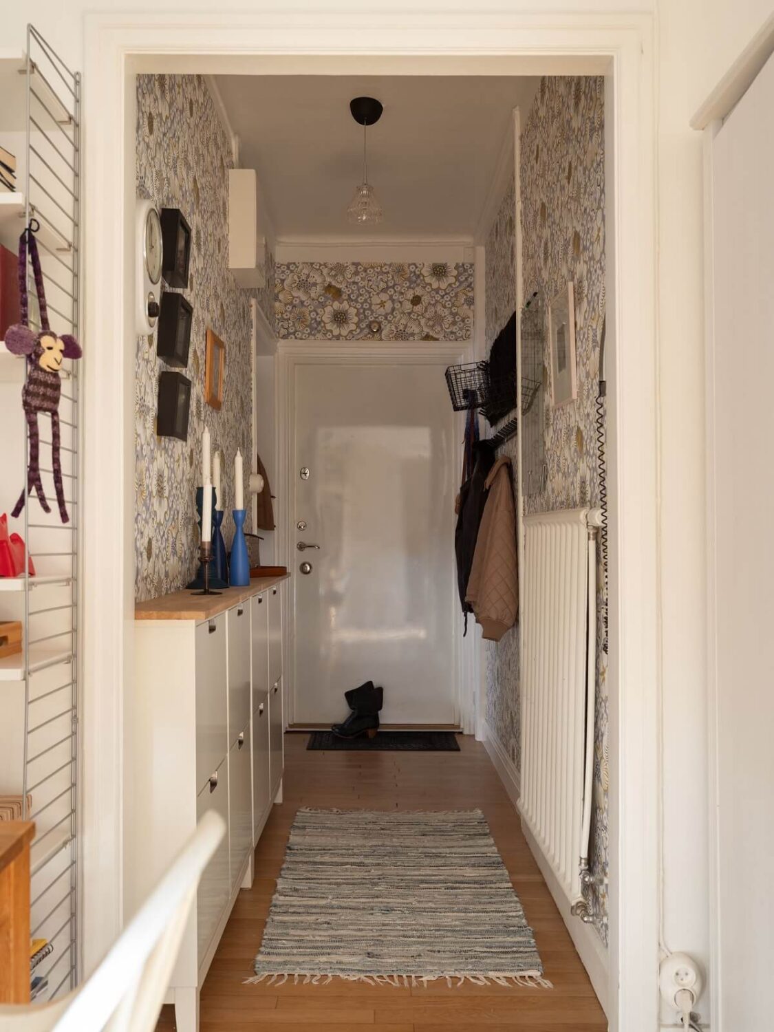 Stylish Small Entryway Ideas with Smart Storage Solutions 10 wallpapered hallway with shoe cabinets