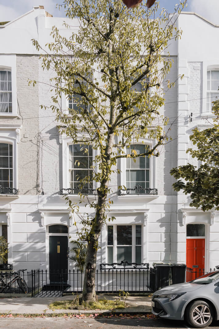A Charming One-Bedroom Apartment with a Courtyard Terrace 17 white apartment building A Charming One-Bedroom Apartment with a Courtyard Terrace