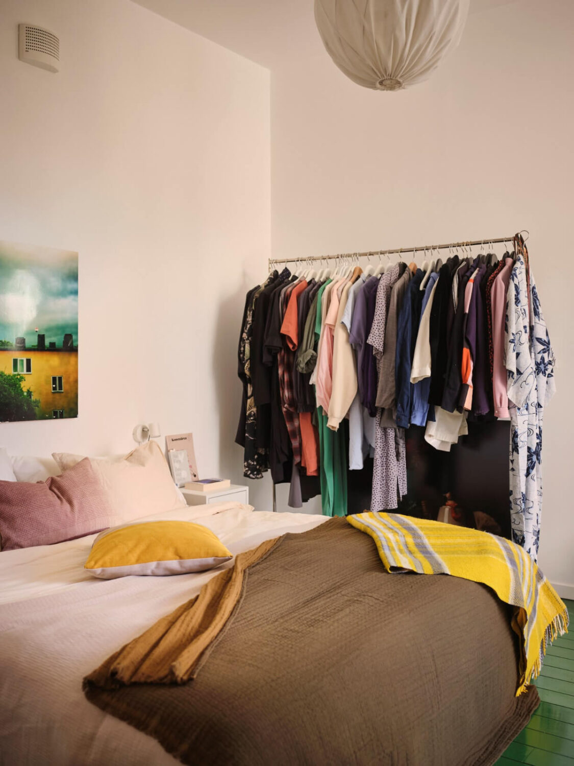 A Bright Family Apartment in a 1950s School Building 18 white bedroom green-painted floorboards