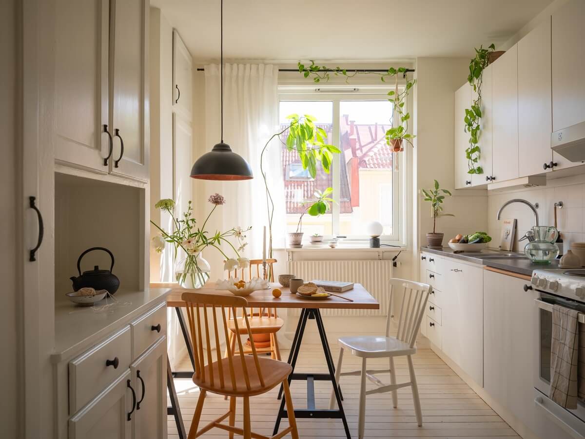 white kitchen with dining table