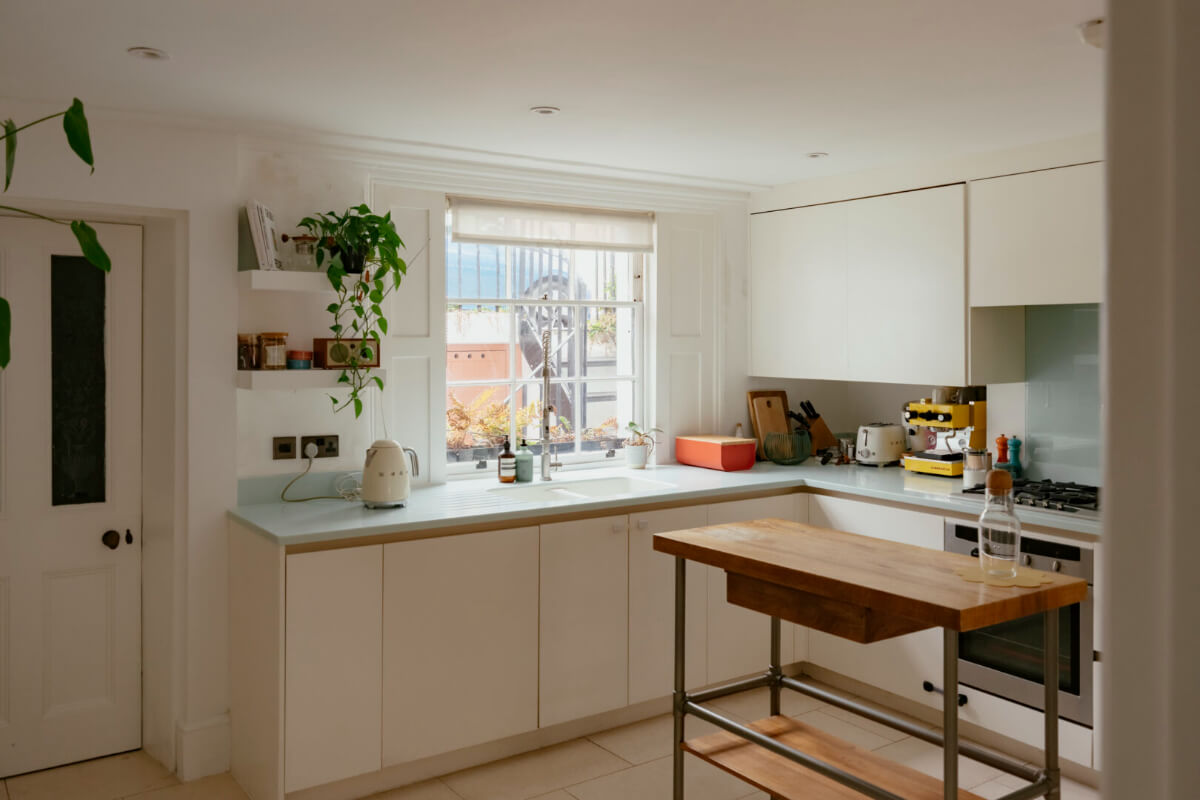 A Renovated Victorian Townhouse with a Small Split-Level Garden 10 white kitchen