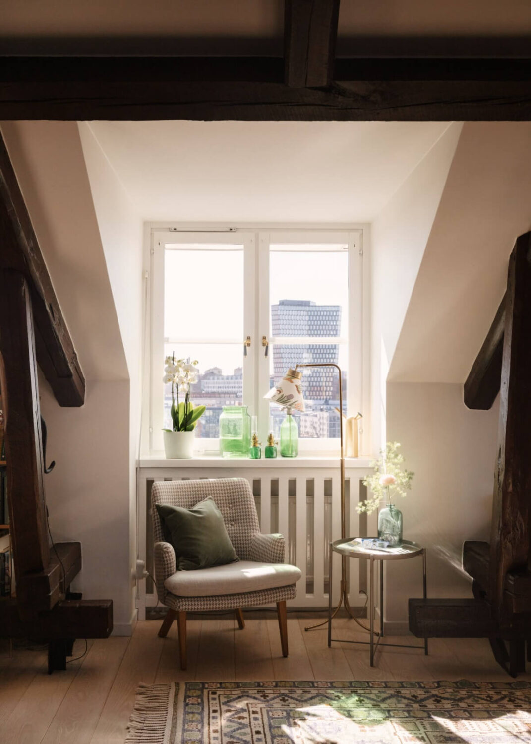 Revisiting a Spectacular Stockholm Penthouse with Exposed Beams 9 window seat