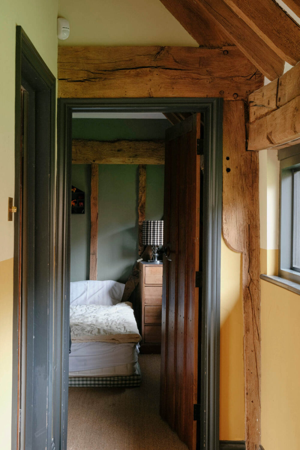 A Barn House with Vintage Decor and Exposed Beams 31 wooden beams bedroom