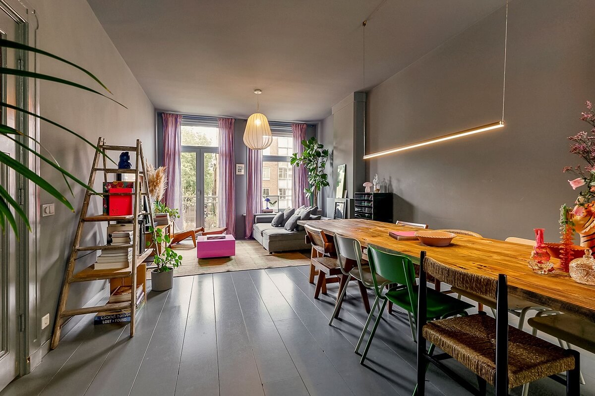 An Amsterdam Apartment with Surprising Bold Color Accents 4 wooden dining table in gray living room