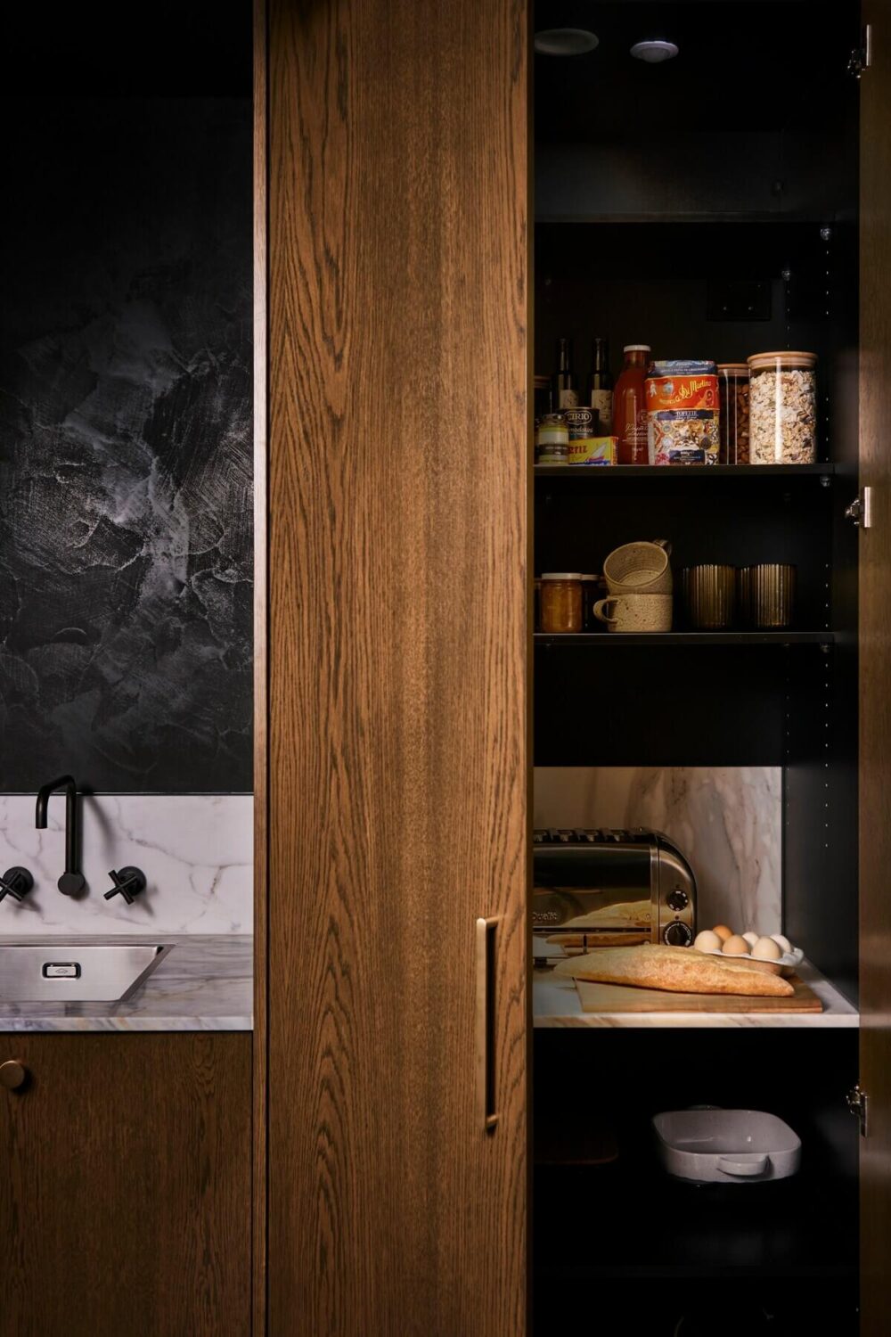 The River Studio: Moody Tones and Luxury in an Australian Airbnb 4 wooden-kitchen-pantry-moody-studio-apartment-victoria-australia-nordroom