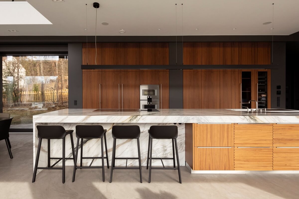 A Luxurious Architect-Designed Villa in Sweden 8 wooden kitchen with marble top and breakfast bar nordroom