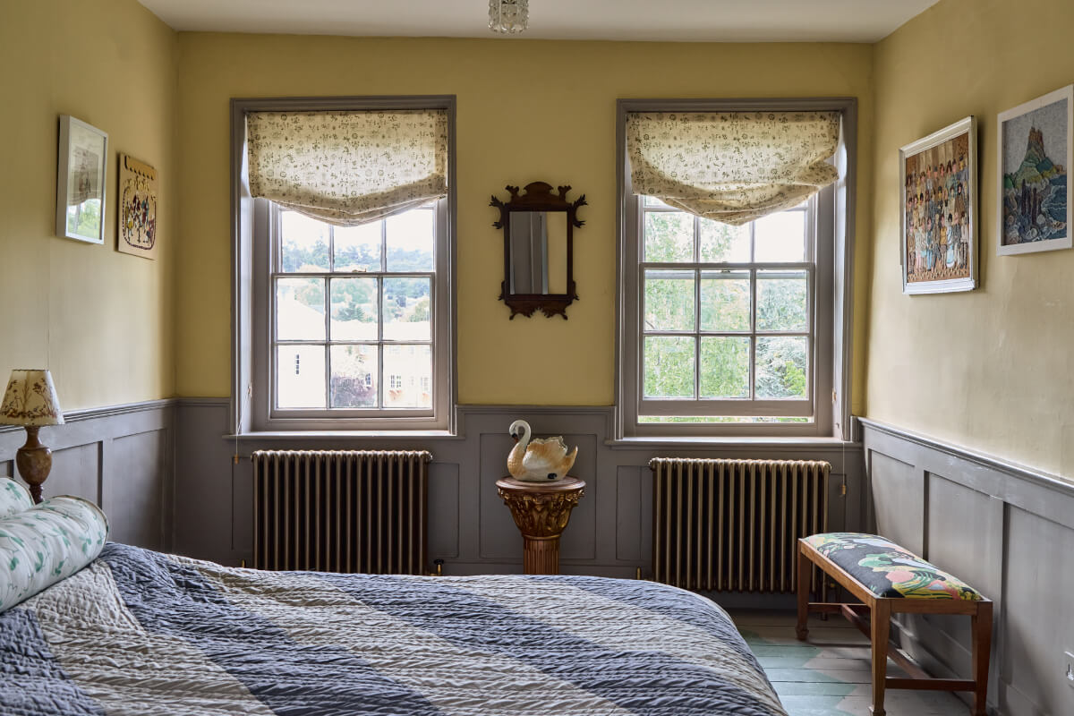 A Colorful Design-Led Georgian House in the Heart of Henley-on-Thames 42 yellow bedroom gray paneling