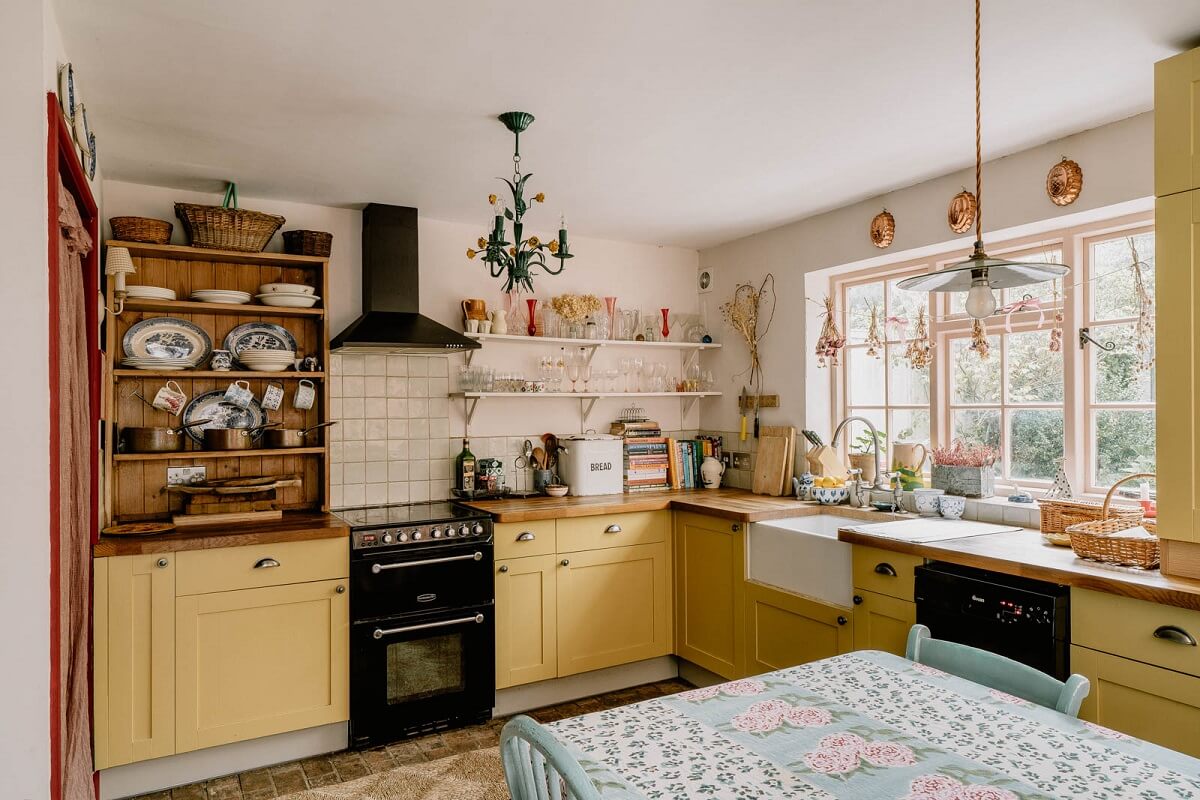 Yellow Kitchen Design Ideas (with Paint Colors) 10 yellow-cottage-kitchen-butler-sink-window-nordroom