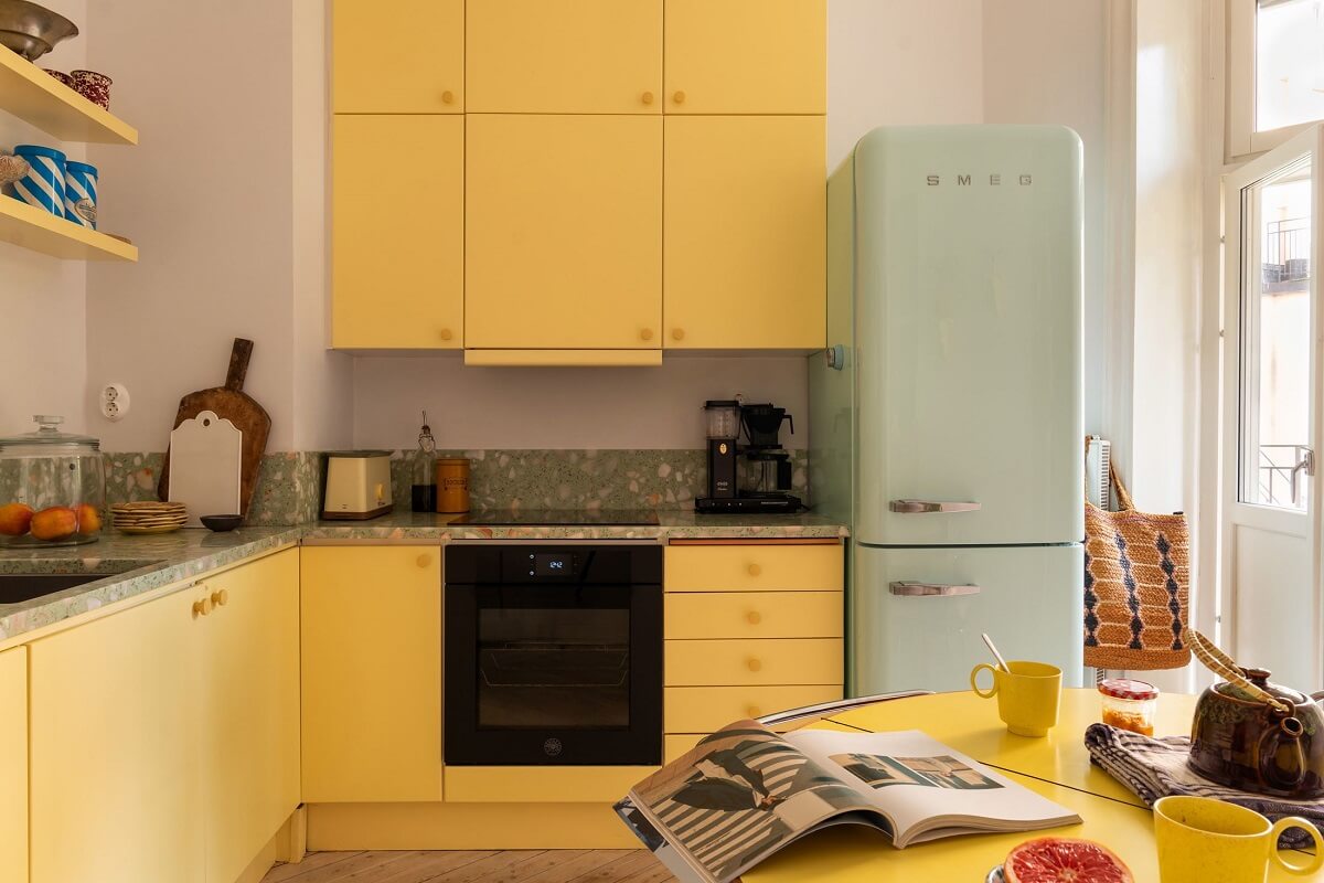 Yellow Kitchen Design Ideas (with Paint Colors) 9 yellow kitchen cabinets and mint green fridge