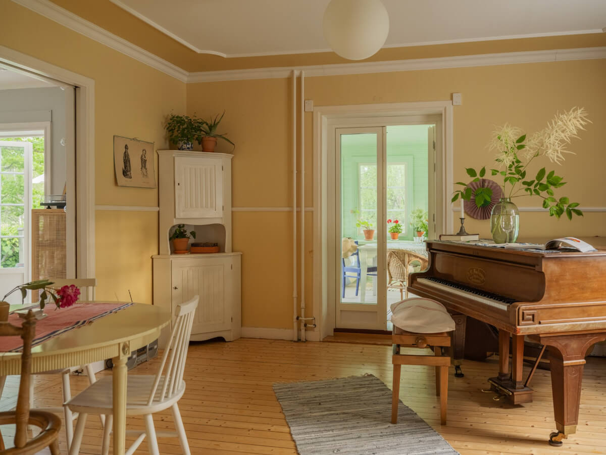 A 1930s Lakeside Country House with a Private Beach 17 yellow music room