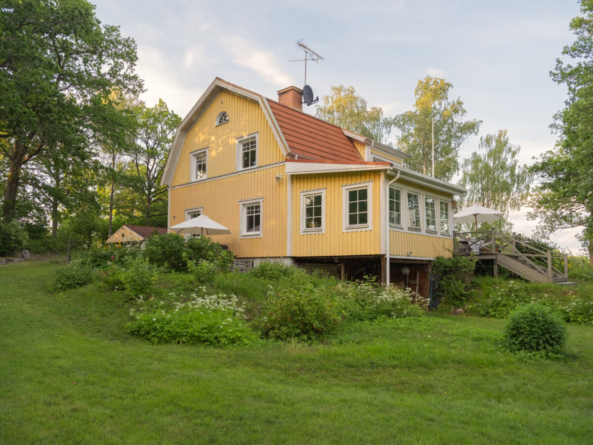 A 1930s Lakeside Country House with a Private Beach 34 yellow swedish country house