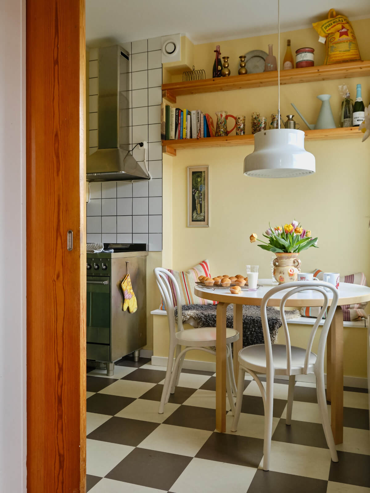 yellow walls checkerboard floor kitchen table