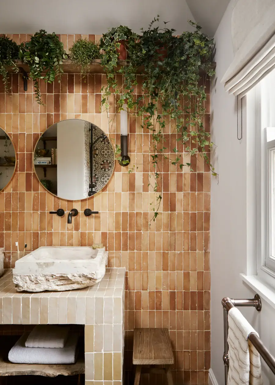 Pantone Color of the Year 2025: Mocha Mousse Interior Inspiration 25 bathroom with plants and brown tiles in various hues Pantone Color of the Year 2025: Mocha Mousse Interior Inspiration