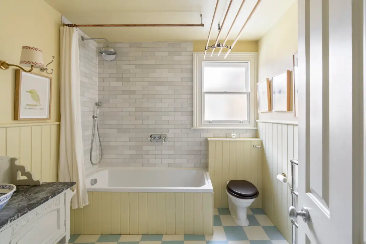 A Beautiful Extended Victorian House in Queen's Park 16 butter-yellow bathroom blue and white checkered floor