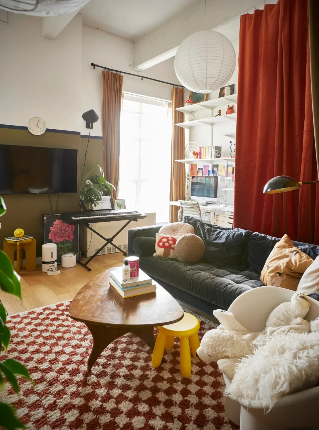 52 Studio Apartments with a Curtain Room Divider 19 colorful-studio-apartment-blood-orange-curtain-behind-sofa-nordroom